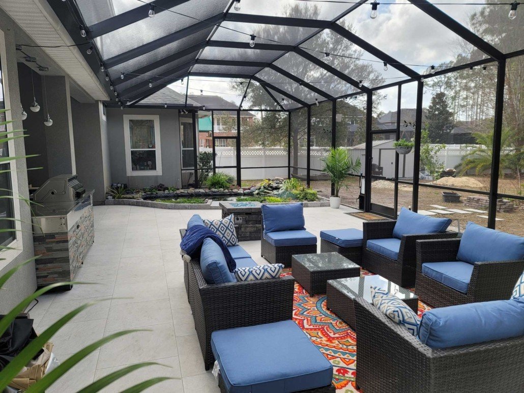 Residential patio screen enclosure with outdoor seating in Sanford, FL backyard